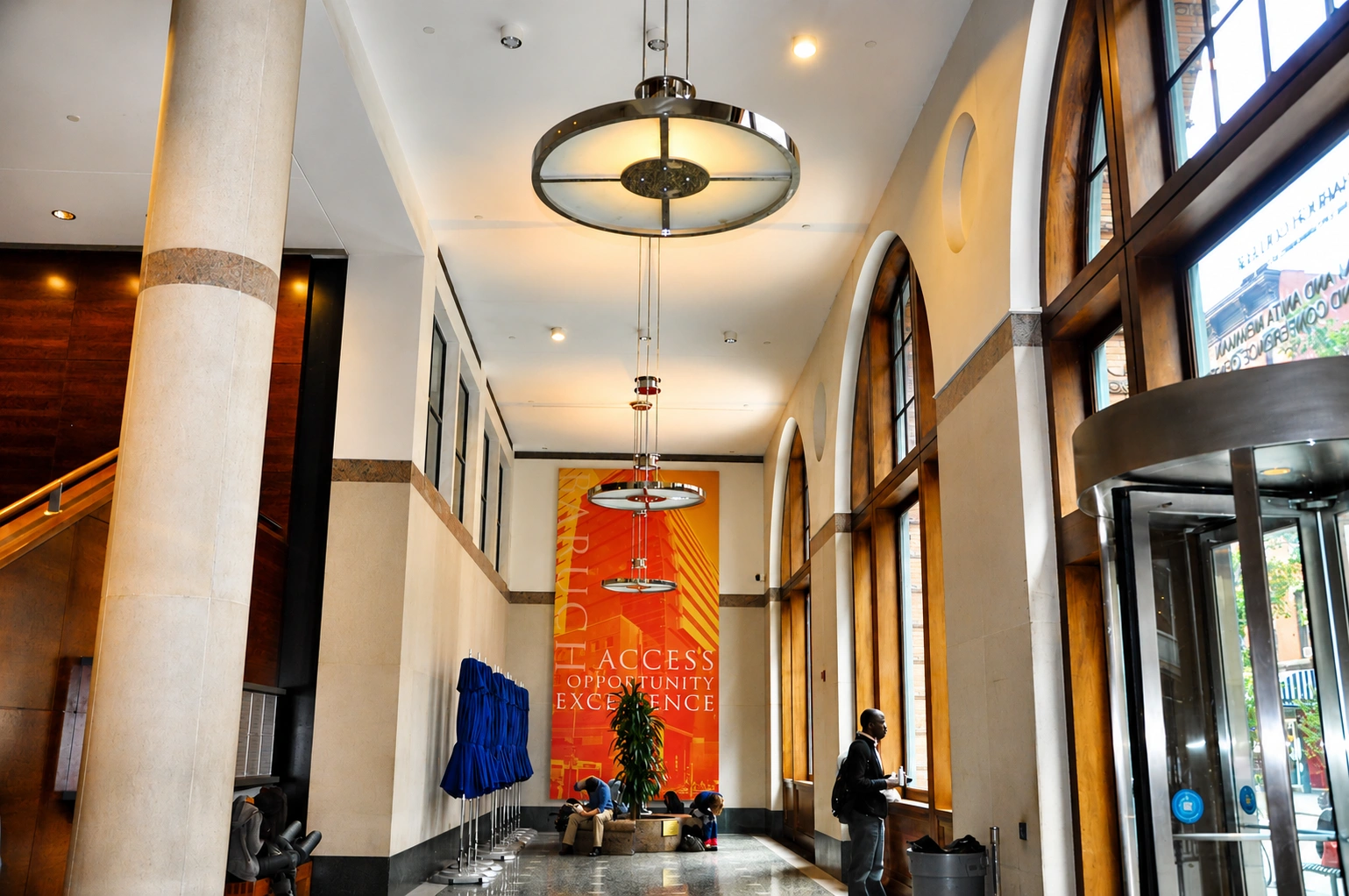 Modern lobby with large windows and decor.