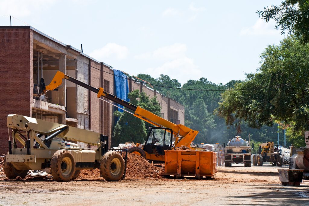 Construction site with machinery and building activity.