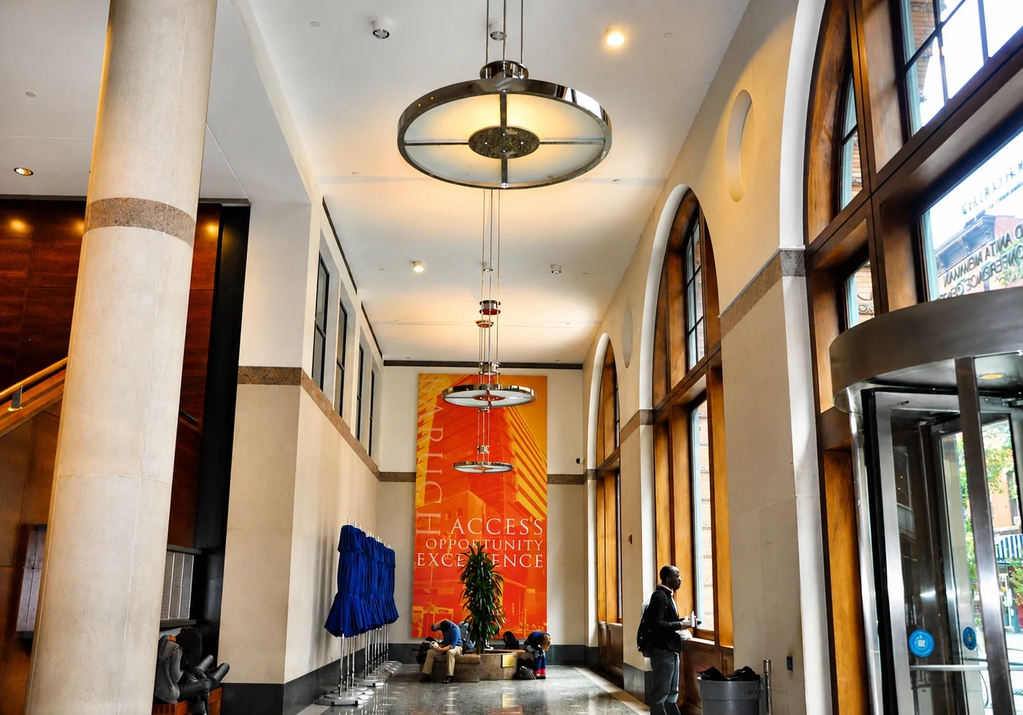 Modern lobby with large windows and decor.