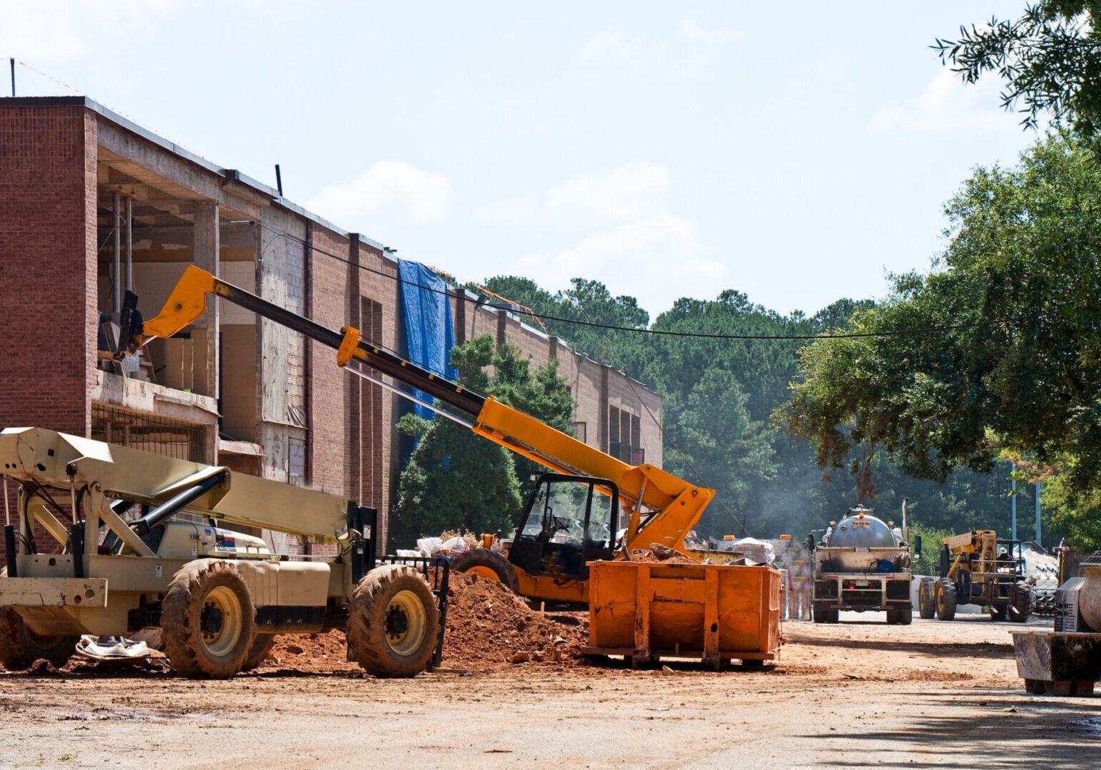 Construction site with machinery and building activity.